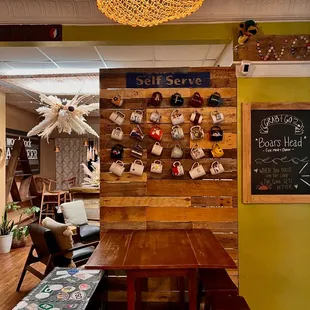 a wooden table and chairs in a cafe