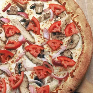 Garlic Bird: Creamy garlic sauce, grilled chicken, &apos;shrooms, red onions and fresh roma tomatoes