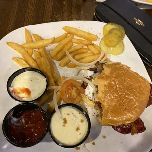 Burger next u see a bit of the chips and queso which looked like they just warmed up sliced American cheese