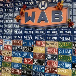 a wall of license plates