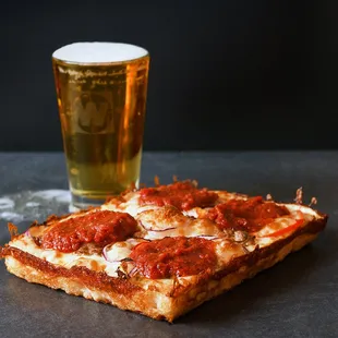 Sausage Supreme Pizza and a pint of beer