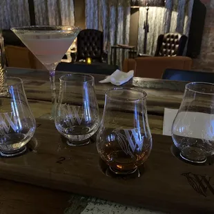 Vodka, traditional gin, rye flight and a Cosmopolitan. (The take-home Glen cairn glass on the right)