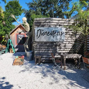 a wooden building with a sign on it