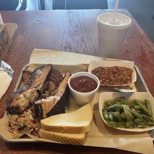 3 meat plate. Ribs, pulled pork, jalapeño sausage. $25 with a medium drink.