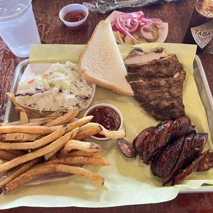 2 meat plate: Chicken &amp; Jalapeño cheese sausage  Two sides: Slaw &amp; Fries