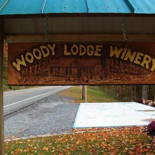 the entrance to woody lodge winery