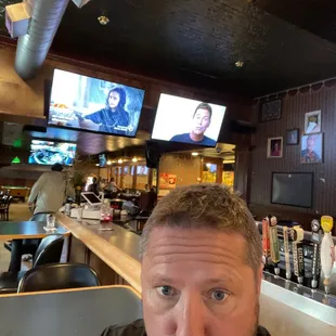 a man drinking a beer