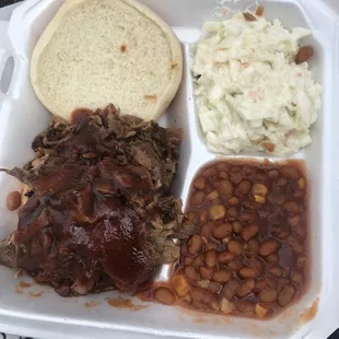 Brisket BBQ sandwich, baked beans, and cold slaw