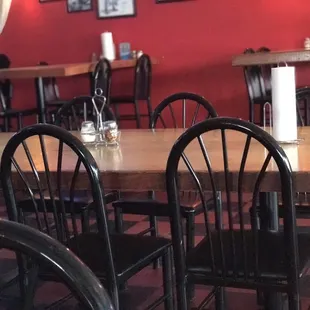 empty tables and chairs in a restaurant