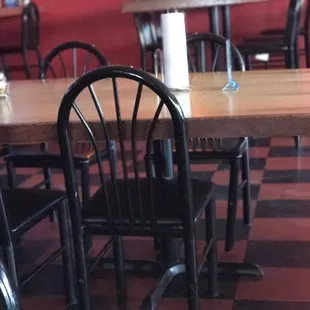 empty tables and chairs in a restaurant