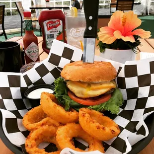The &quot;OMG&quot; burger with a side of onion rings.