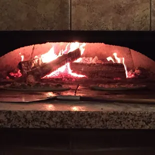 My pizza being made in the wood burning oven.