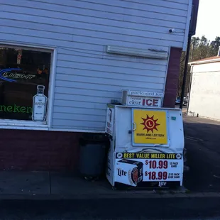 a refrigerator and a sign on the side of a building