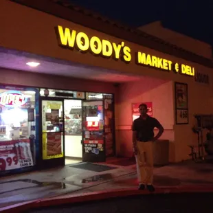 a man standing in front of the store