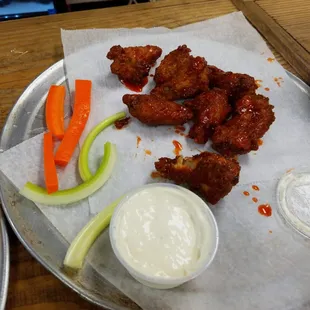 Honey sriracha wings, partially eaten