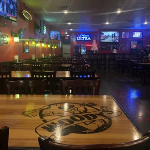 a wooden table and chairs in a restaurant