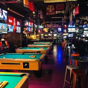 5 pool tables, golden tee, buck hunter and vintage arcade games like Mrs Pac-Man, donkey Kong, dig dug,  shuffleboard and Comet pinball