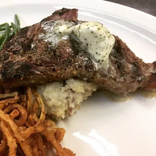 Bison Ribeye, Bleu cheese butter, onion shreds in salt and pepper mashers
