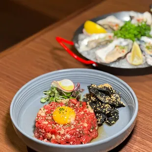 Yookhwe (Beef Tartare) - Raw beef, raw egg yolk, korean pear, crispy seaweed.