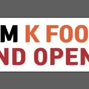a sign that says premium k food mall grand opening