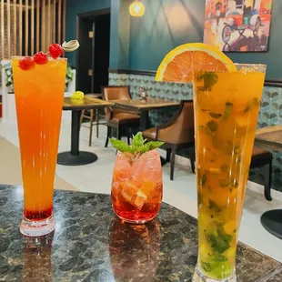 two cocktails on a table in a restaurant