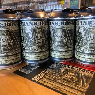 four cans of beer on a table