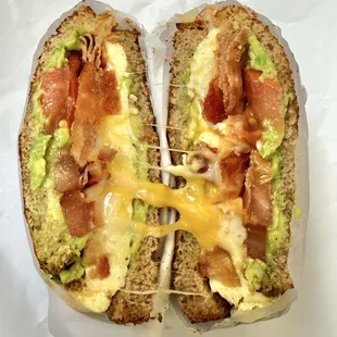 #2 Breakfast Melt with bacon, egg, avocado, on wheat toast.