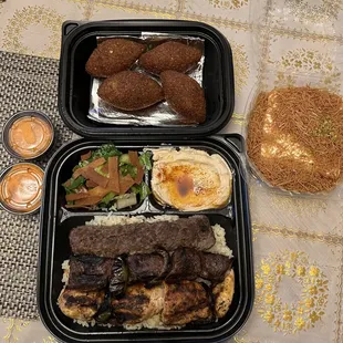 Kabob combo (bottom) fried kibi (top), spicy garlic sauce (left) and osmaliyeh (right).