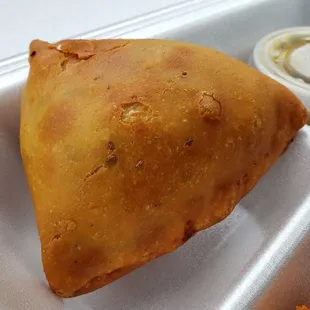 Samosa  ($2.75), vegan by default. Pretty good though I didn&apos;t like the raisins inside.