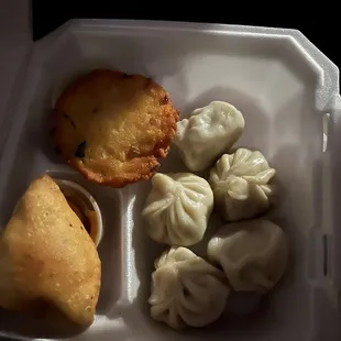 Combo meal: bara, lassi, samosa, and momos