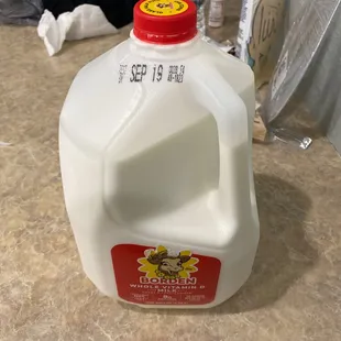 a gallon of milk on a counter