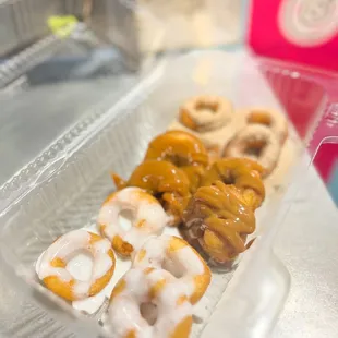 a variety of donuts in a container