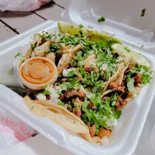 a salad in a styrofoam container