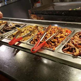 Dumplings, mackerel, "steamed" bass (more fried), and hibachi stove behind