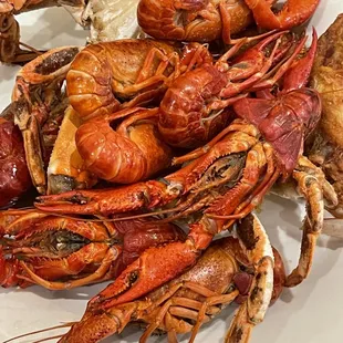 a plate of cooked lobsters