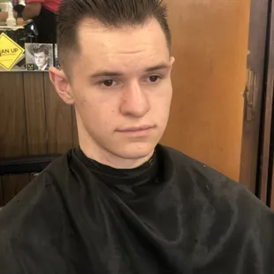 Slicked back haircut by Jesus