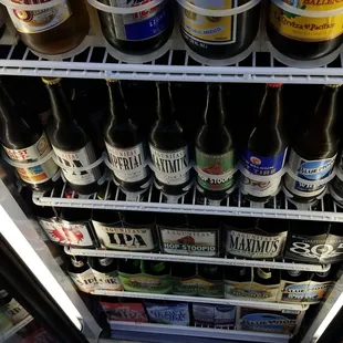 a refrigerator full of beer bottles