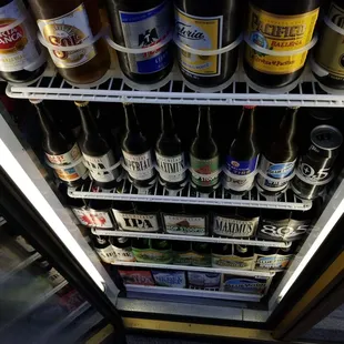 a refrigerator full of beer bottles
