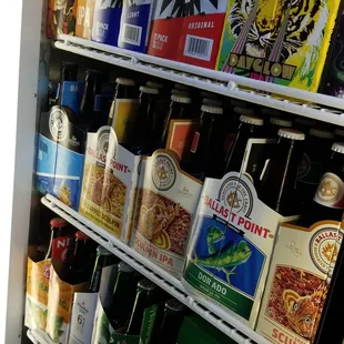 a refrigerator full of beer bottles