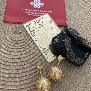 Earrings $130, gold card $11, pouch $0.49, vax card holder free