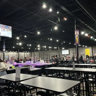 a large room with tables and chairs