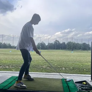 Second time at the driving range and probably doing it totally wrong, but he loves it!