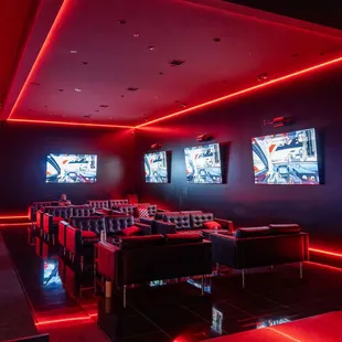 Our lounge with twelve couches and four 98" tv's that show the live in-house racing.