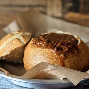 a bowl of chili bread