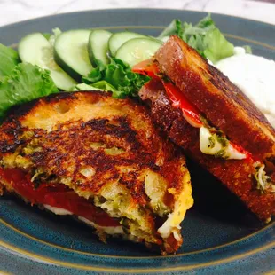 Pesto grilled cheese with tomato and a side salad