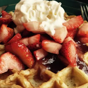 Strawberry topping on buttermilk Belgian waffles