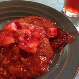 Vegan pancakes with a vegan strawberry rhubarb topping, with iced tea with mint from their garden. Amazing!