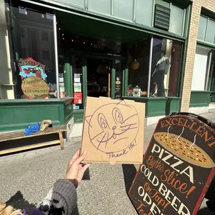 Exterior- hand drawing gratitude by owner on pizza box