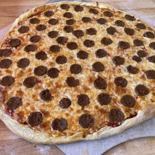 Vegetarian Plant-based pepperoni pizza with whole milk mozzarella cheese on a homemade crust with delicious red sauce base. Field Roast Meat