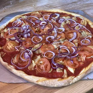 Dairy Free! Fany Vegan pizza with Roma tomatoes, Artichoke hearts and Red onions on our flavorful red sauce